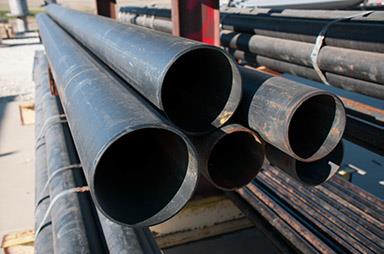 Metal Pipes stacked in Warehouse - Advanced Industries