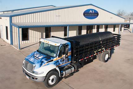 Semi truck carrying product in front of warehouse - Advanced Industries